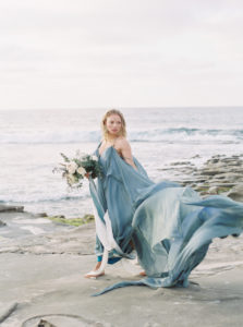 So Cal Bride on beach in blue gown bouquet