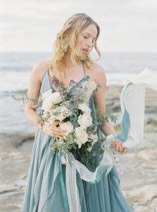 Bride on beach san diego california in blue wedding gown