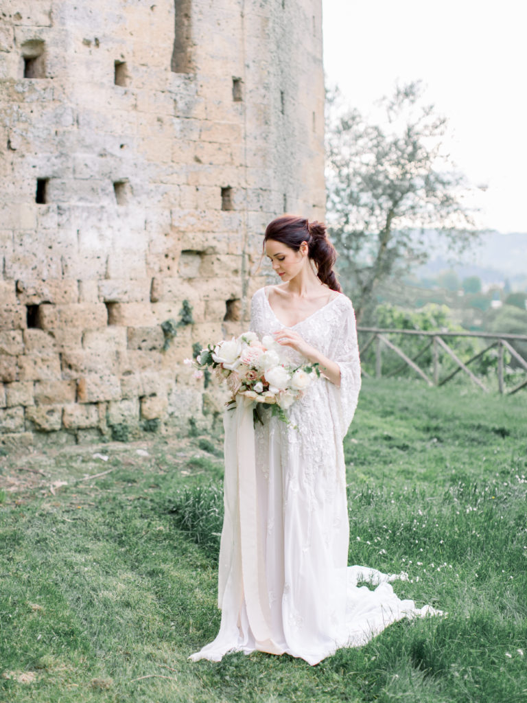 bride in white dress bouquet in italy