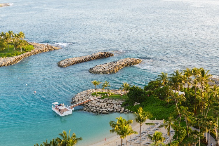 Four Seasons Resort Oahu | Luxury Hawaii Wedding Venue 2 a boat on a beach at the four seasons resort oahu