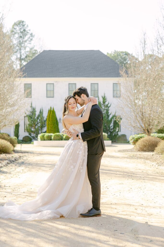 50 Questions to Ask a Wedding Venue Before You Book: A Raleigh Couple's Checklist 1 Couple embracing in front of Bradford North Carolina Wedding Venue
