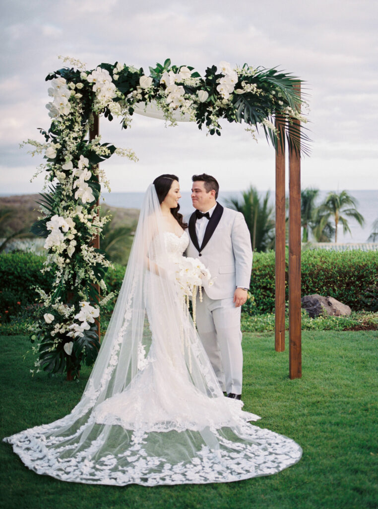 Bride and groom ceremony arch lanai