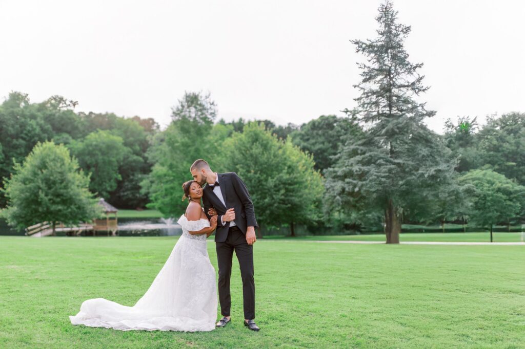 A Joyful Summer Wedding at a Private Estate in Raleigh, NC 13 Raleigh North Carolina wedding venue. Bride and Groom in a loving embrace.