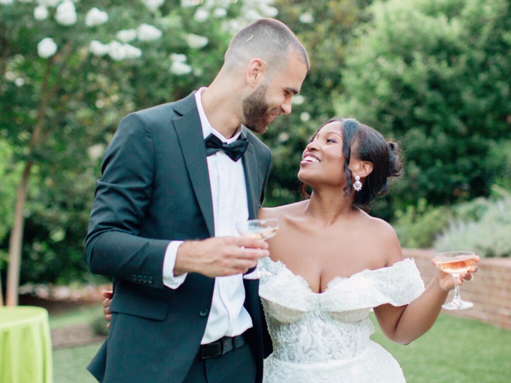 A Joyful Summer Wedding at a Private Estate in Raleigh, NC 23 North Carolina wedding photographer couple toasting each other