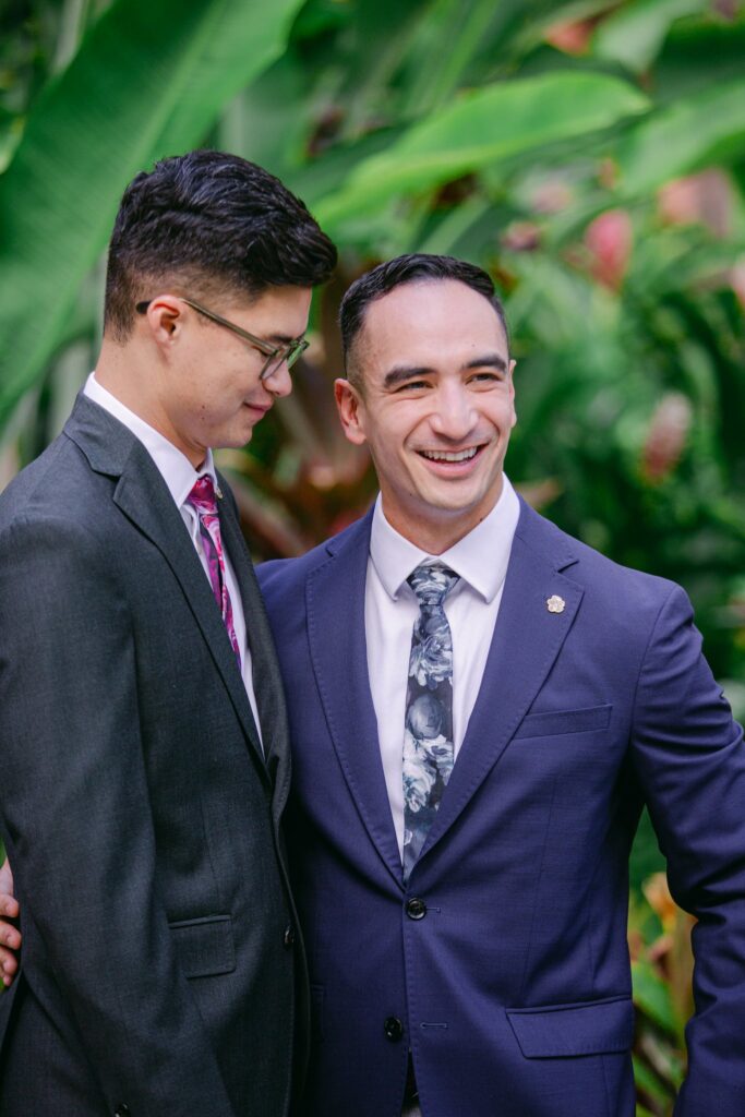 Two men embracing at the royal hawaiian hotel